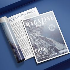 an open magazine on a blue surface with the title free magazine mockup in it