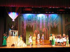 a group of people standing on top of a stage