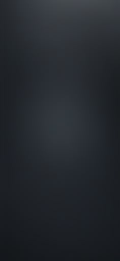 a black and white photo of the back side of a cell phone that is turned on