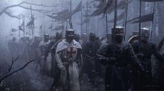 a group of people dressed in medieval armor walking through the woods with flags behind them