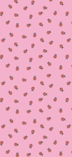 a pink background with ladybugs on it