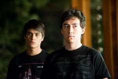 two young men standing next to each other