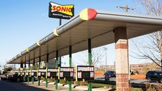 a sonic gas station with cars parked in the lot