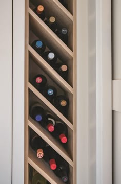a wine rack with many bottles in it