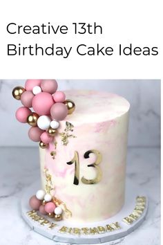 a pink and gold birthday cake with the number 13 on it