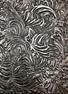 an abstract painting with black and white swirls