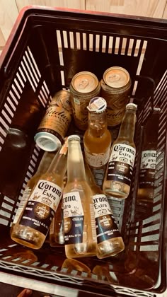 bottles of beer are sitting in a basket