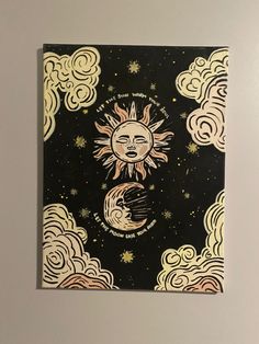 the sun and moon are depicted in this hand drawn drawing on black paper with white clouds