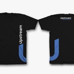 two black shirts with blue and white designs on the front, one has an upside down logo