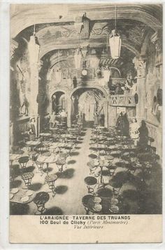 an old black and white photo of a dining hall