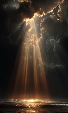 the sun shining through clouds over water