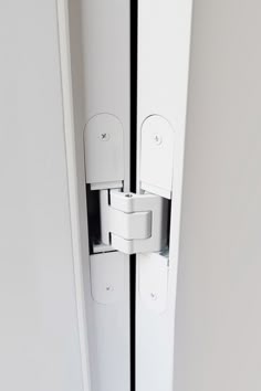 an open door with two white handles on it