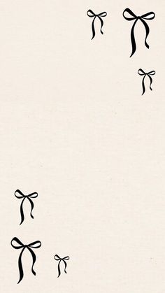an image of some black bows on white paper