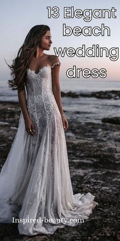 a woman in a white wedding dress standing on rocks near the ocean with text overlay that reads 18 elegant beach wedding dresses