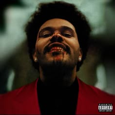 a man with his eyes closed looking up