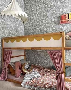 a child's bedroom with bunk beds and curtains