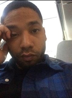 a man holding a cell phone to his ear