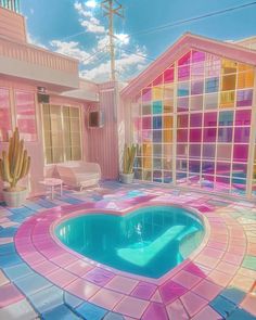a pool in the middle of a room with colorful tiles on the floor and walls