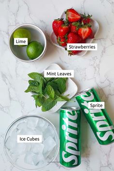 the ingredients needed to make an ice cubes recipe on a marble countertop with limes, strawberries, mints and water