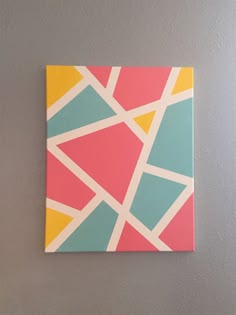 an abstract painting on the wall in a room
