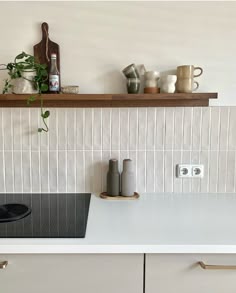 the kitchen counter is clean and ready to be used as a cooktop area for cooking