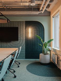 an empty conference room with a plant in the center