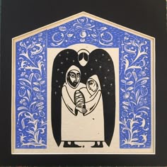 a blue and black framed artwork with an image of a woman holding a baby in her arms