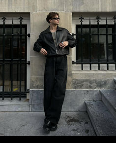 Effortlessly cool men’s spring style featuring a relaxed black leather jacket, taupe tank top, and wide-leg black trousers. Finished with chunky black loafers, sunglasses, and statement rings, this minimalist look balances bold accessories with timeless menswear silhouettes. Follow TheStyleEdit for more Fashion Inspo!  Credit: IG oscarkeuning  #MensStyle2025 #SpringMensFashion #MenswearInspo #MinimalStreetStyle #MensLeatherJacket #CasualMensOutfit Baggy Pants Suit, Black Leather Jacket Men Zara, All Black Outfit Men 2025, Fboy Style, Amsterdam Style Men, Mens Outfits Black, Men’s Black Outfits, Edgy Fashion Men, Black Bomberjack Outfit Men