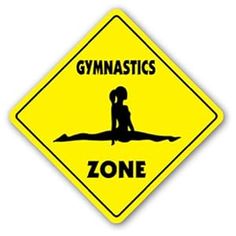 a yellow sign that says gymnastics zone with a silhouette of a person sitting on the ground