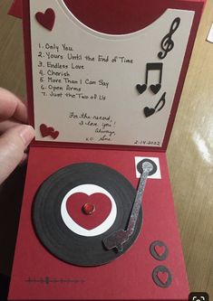 a handmade record player card with musical notes