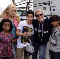 a group of people standing next to each other