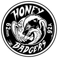 the honey badgers logo is shown in black and white, with an image of a snake