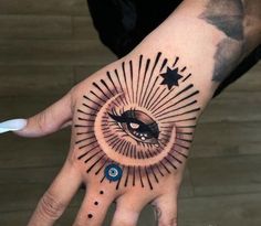 a hand with an eye and stars on it