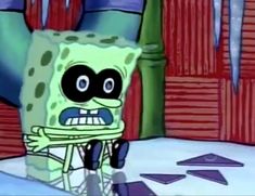 an animated spongebob character sitting on a chair