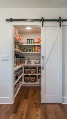 an open pantry with sliding doors and shelves