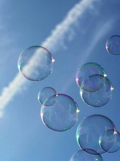 soap bubbles floating in the air on a sunny day