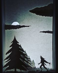 a paper cut out of a person walking through the woods at night with trees and moon in background