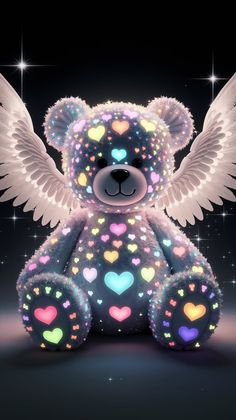 a teddy bear with wings and hearts on it's chest sitting in front of a black background