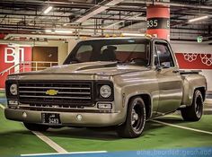 a silver truck parked in a parking garage