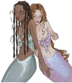 two women dressed as mermaids with braids
