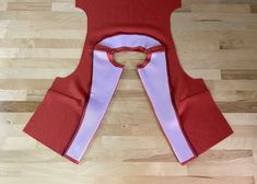 a piece of clothing sitting on top of a wooden floor