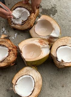 coconuts are being peeled and cut into pieces