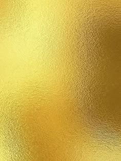 an abstract gold background with some light reflections on the surface and it's very shiny