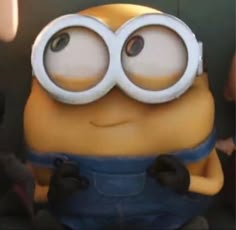 a close up of a minion with big eyes