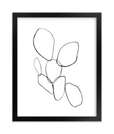 a black and white drawing of a flower in a wooden frame on a wall or floor