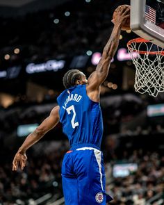 the basketball player is going to dunk the ball