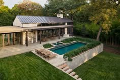 an aerial view of a house with a swimming pool