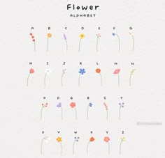flowers are arranged in the shape of letters and numbers on a sheet of paper that says flower