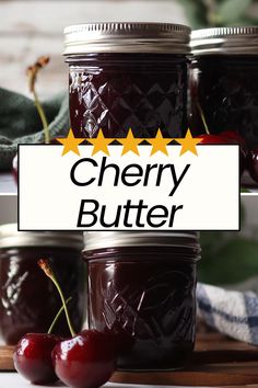 three jars of cherry butter sitting on top of a cutting board next to cherries