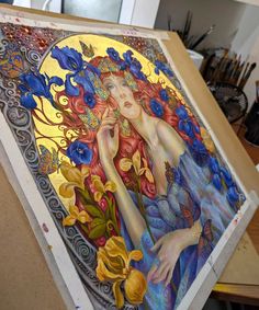 a painting is being displayed on a table